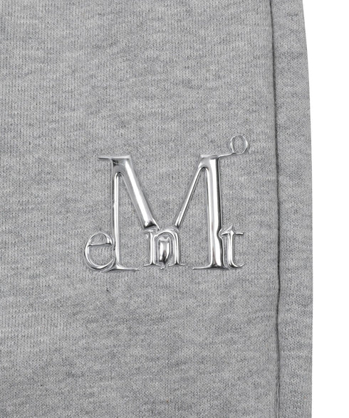 MUCENT(ムセント)/ユニセックス ワイド ルーズ ロゴ ジョガー スウェットパンツ/LASH METAL LOGO JOGGER SWEAT WIDE PANTS UNISEX | AT2252030 | グレー