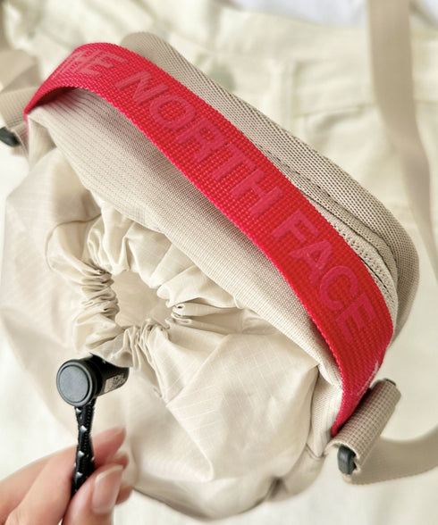 THE NORTH FACE(ザ・ノースフェイス)/巾着ポーチストリングショルダーバッグ スマホショルダー/BREEZE CROSS BAG | IM1243026 | サンドベージュ