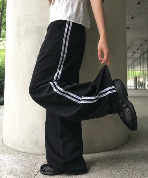 anyonemore(エニワンモア)/サイドレースライン ドローストリング トラック トレーニング パンツ/Dove Line Track Training Pants | AT2254034 | ブラック